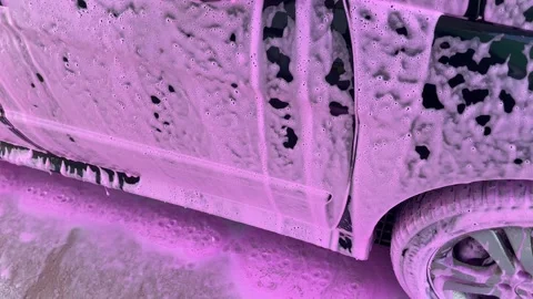 Man Driver Applying Pink Foam To Black auto Wash At Car Wash For Vehicle Care Stock Footage 331544116