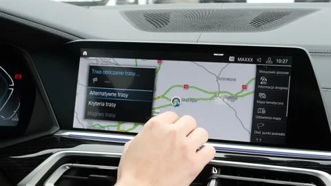 A Man Driver Checks a Navigation Map on a BMW Car Computer Screen Stock Footage 140938796