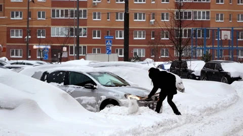 Man, Driver Cleaning Snow by Car in Parking Lot Stock Footage 160054653