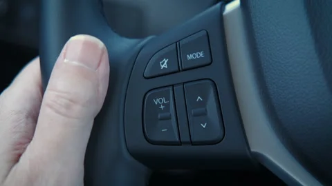 Man driver control the radio inside. Stock Footage 280143234