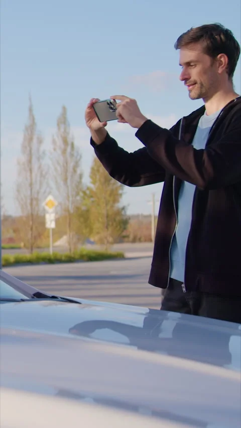 Man driver scans QR code on windscreen of carsharing vehicle Stock Footage 300544132