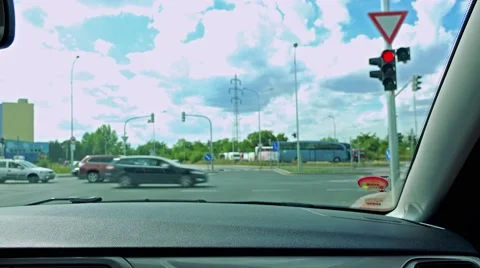 Man drives a car in the city - man waits in front of the crossroads Stock Footage