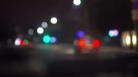 A man drives a car through the streets of a night city. Close-up of dashboard. Video stock 151024796