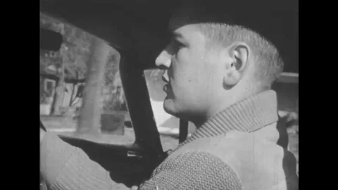 A man drives down the road as a narrator explains the importance of driving Stock Footage 116255109