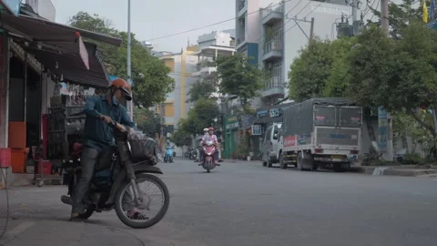Man Drives Off on Fully Loaded Scooter – Ho Chi Minh City – Feb 26 Stock Footage 303045698