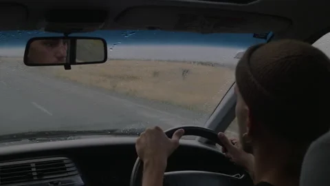 A man drives his van on the roads of New Zealand in the rain Stock Footage 217439841