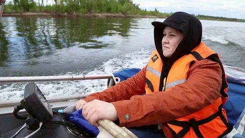 The man drives a motor boat Stock Footage 76043405