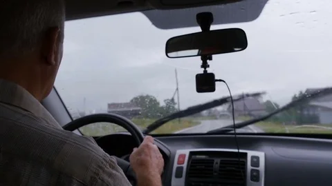 Man is driving along the road by car Stock Footage 80151891