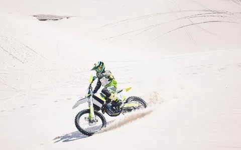 Man, driving and motorbike on sand for sport, adventure or competition outdoor Stock Photos