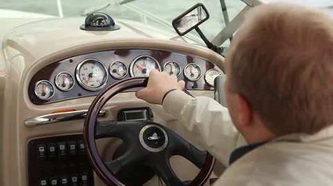 Man driving a boat Stock Footage 44225955