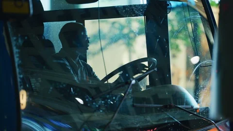 Man driving a bus Stock Footage 99916575