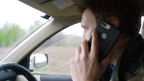 Man driving car and Makes a Phone Call Stock-Footage 111133765