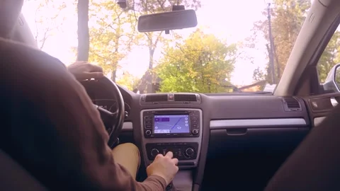 Man driving car and use navigation in multimedia Stock Footage 247083095