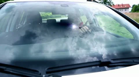 Man driving car with cloudscape on windshield Video stock 28961932