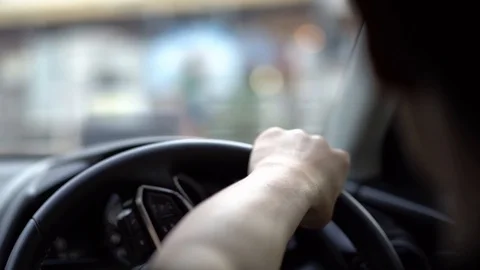 Man driving car in day time, hand on steering wheel, shallow depth of field Video stock 126310052