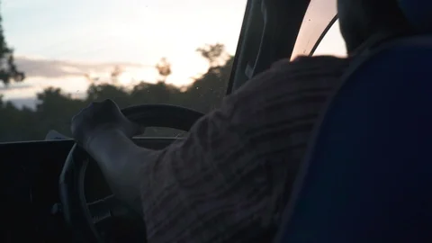 Man driving car a at dusk Stock Footage 85788747