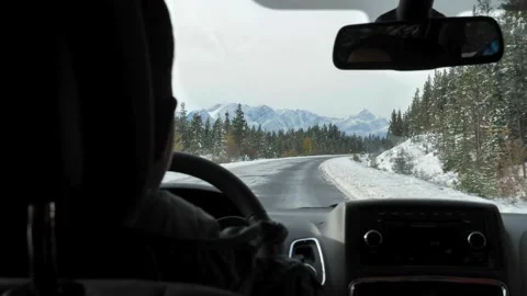 Man driving car on the empty road. hands confidently hold steering wheel while 스톡 동영상 336267821