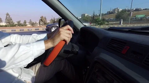 The man is driving a car. Stock-Footage 79126083