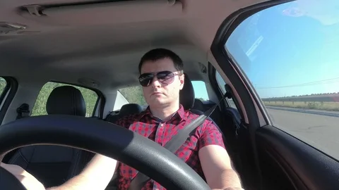 Man driving a car Stock Footage 90305304