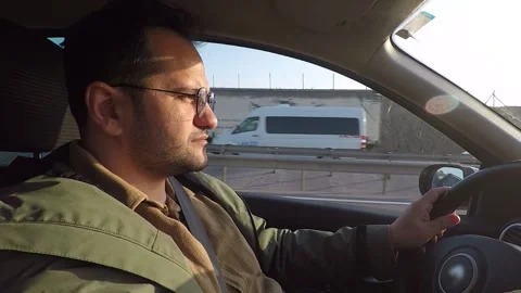 Man driving car Stock Footage 188419636