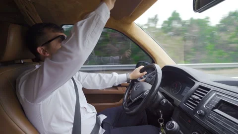 The man driving a car. Stock Footage 212389477