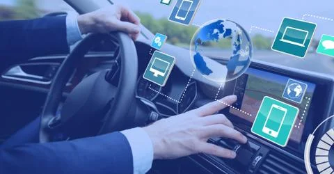 Man driving in car with heads up display interface Foto stock