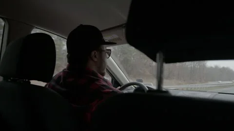 Man Driving Car on Highway on Overcast Day Stock Footage 343935955