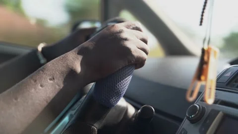 Man driving a car midday 스톡 동영상 219593975
