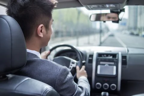 Man driving car with navigation system Stock Photos
