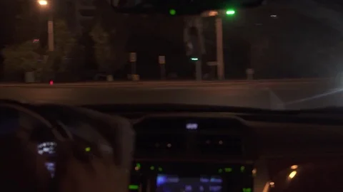 Man driving a car at night 4K Stock Footage 80418936