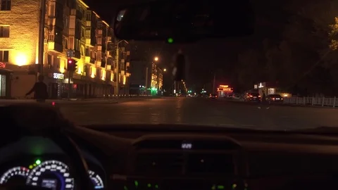 Man driving a car at night 4K Stock Footage 80418957