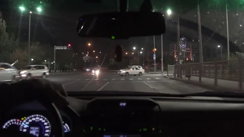 Man driving a car at night 4K Stock Footage 80418968