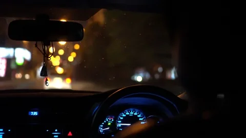 Man driving in car at night Stock-Footage 107473387