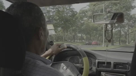 A man driving a car in Panama Stock Footage 343743147