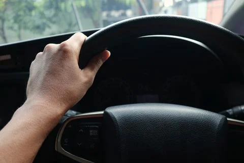 A man is driving a car Stock Photos