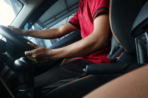 A man is driving a car Stock Photos