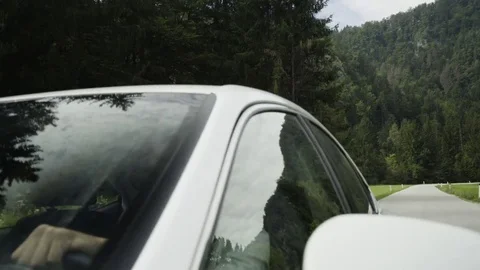 Man driving a car on road Stock Footage 71533721