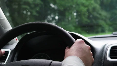 Man driving car on road. Shallow depth of field. Slow motion 4k UHD video Stock Footage 77769341