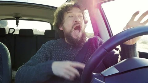 Man driving car saying I love you looking camera slow motion Stock Footage 71272485