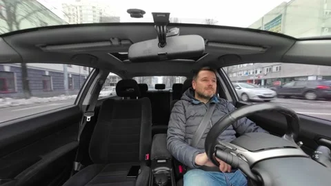 Man driving a car. Shot from windshield of a car, car interior. Video stock 224121556