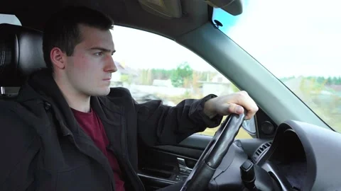 A man is driving a car. side view Stock Footage 158436228