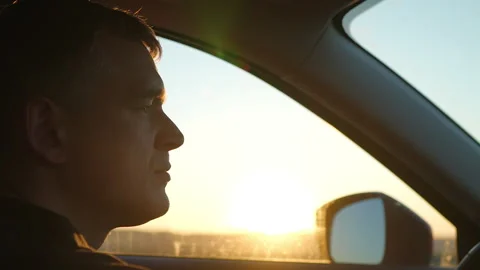 Man driving car at sunset Stock-Footage 312412860