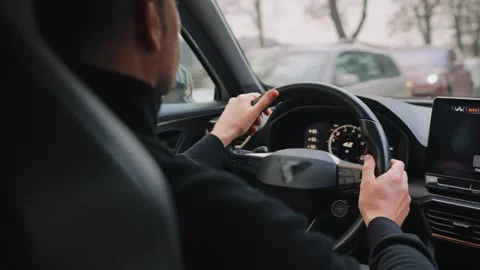 Man driving car through the streets of the city Stock Footage 301542923