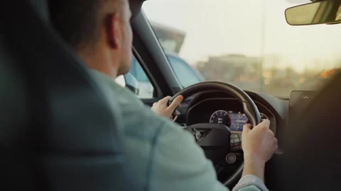 Man driving car through the streets of the city. Slow motion Stock Footage 310268367