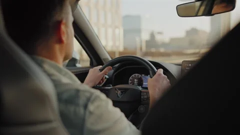 Man driving car through the streets of the city. Stock Footage 312014977