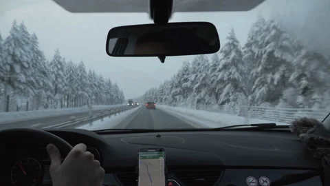 Man driving a car through the winter road Stock Footage 86646993