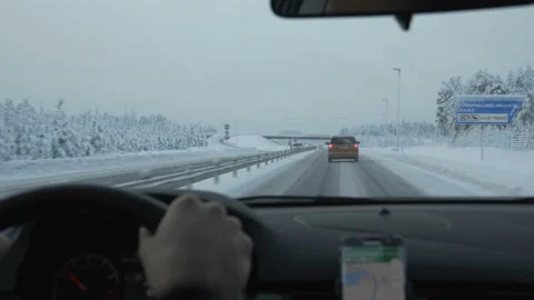 Man driving a car through the winter road Video stock 86647217