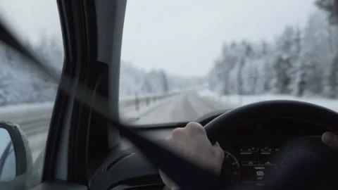 Man driving a car through the winter road Stock Footage 88650976