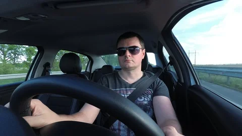 Man driving a car time lapse Stock Footage 89973311