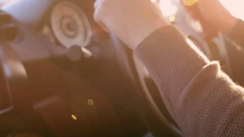 Man is driving a car under the sun. Closeup hands on steering wheel 스톡 동영상 74433973